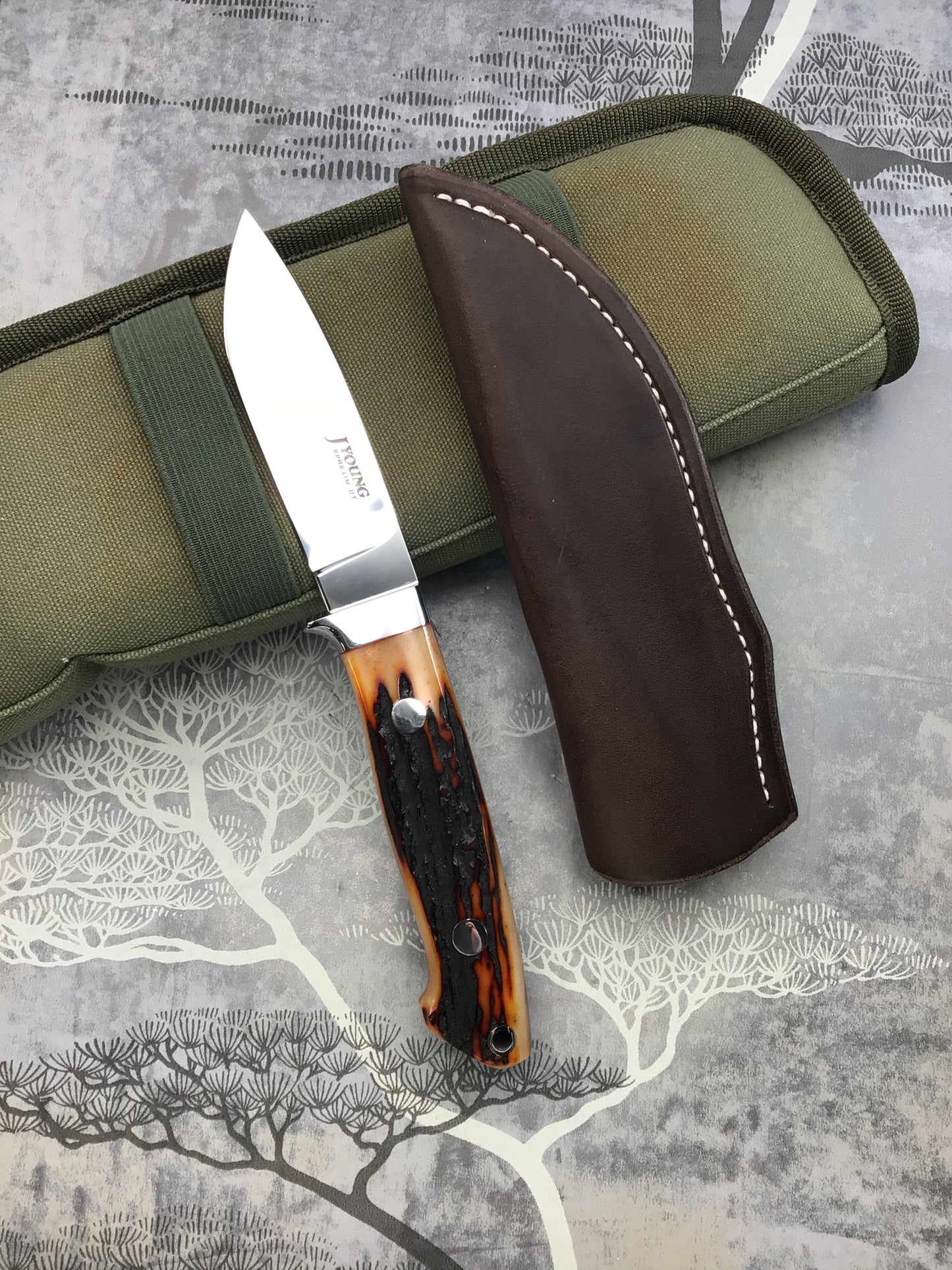 John Young “Loveless Style” Drop Point Hunter with Amber Sambar Stag Scales